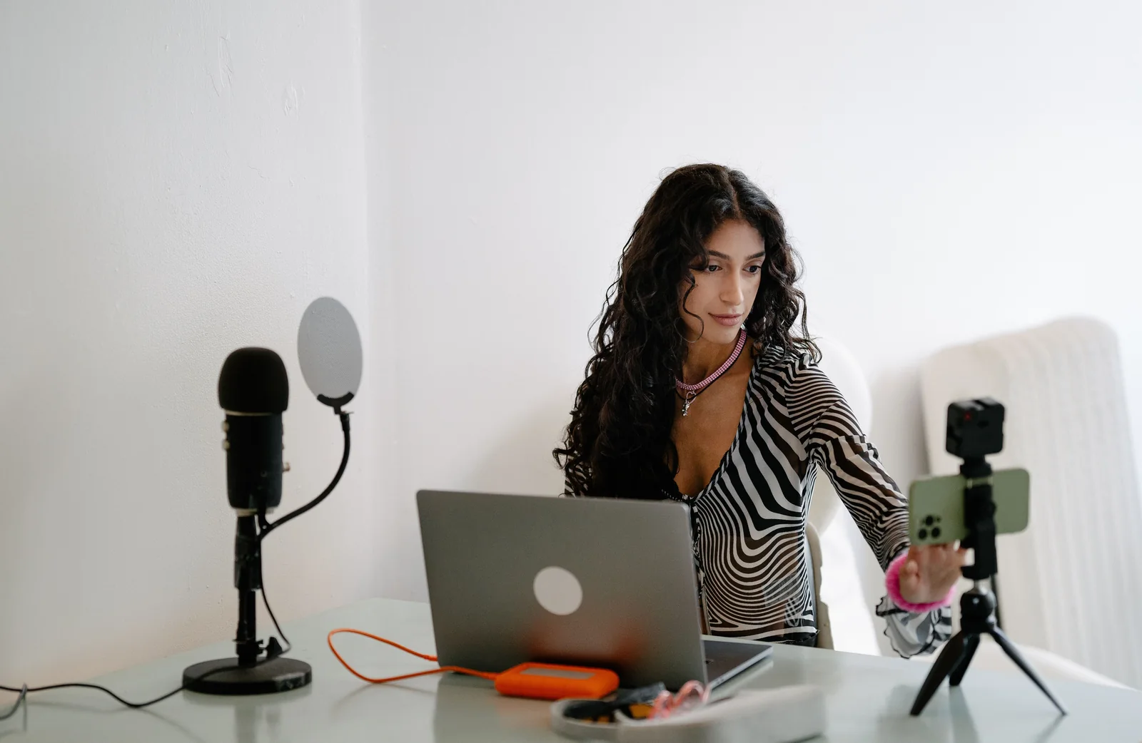 A creator producing a live stream from a studio desk